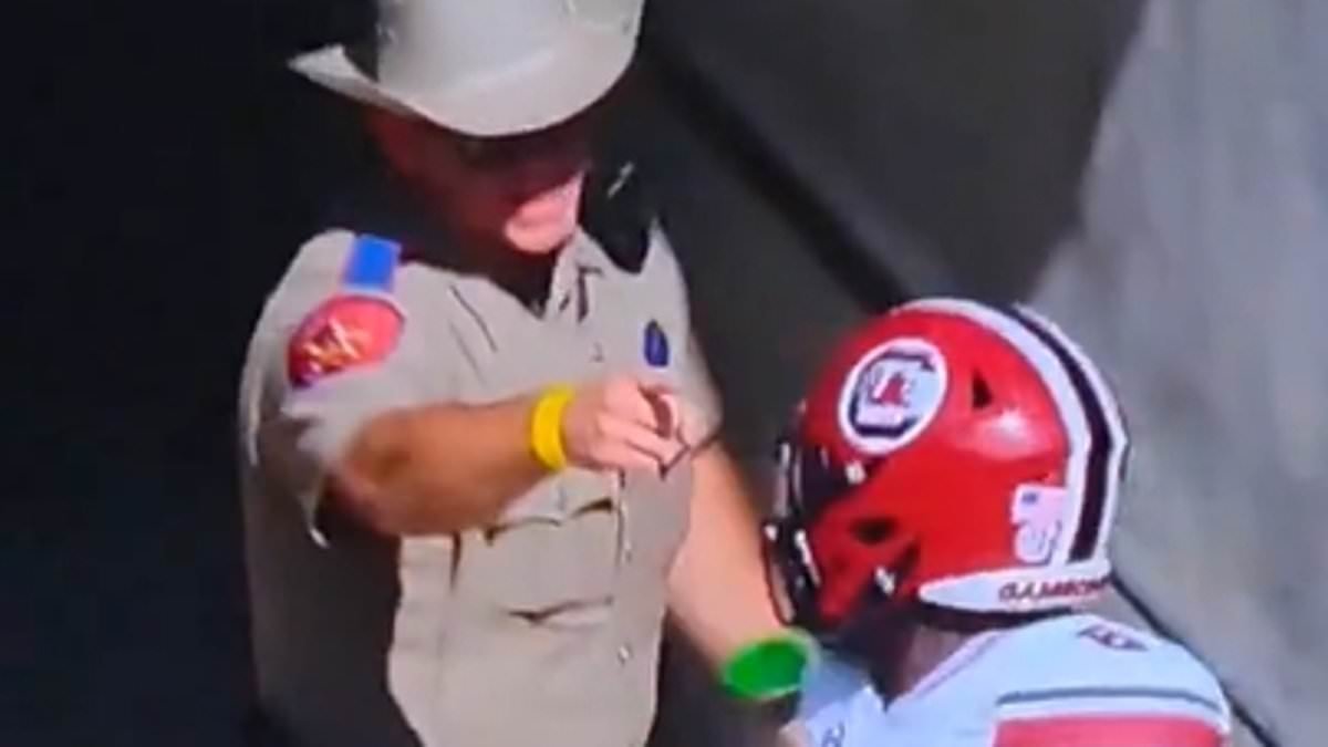 FURY ERUPTS as Texas Cop Confronts South Carolina Players in Tunnel Clash! second image